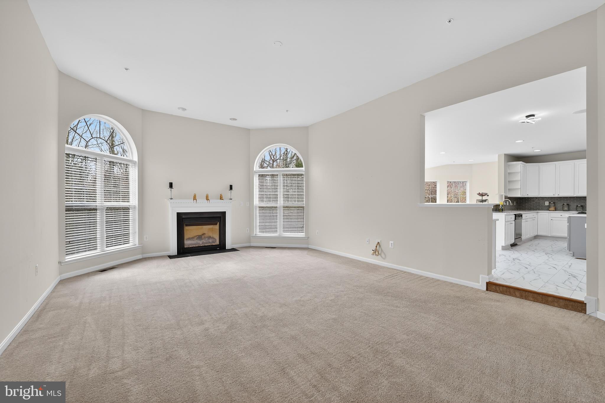 16101 Venice Road Aquasco, MD 20608 - Photo 25 of 60 an empty room with furniture and a fireplace