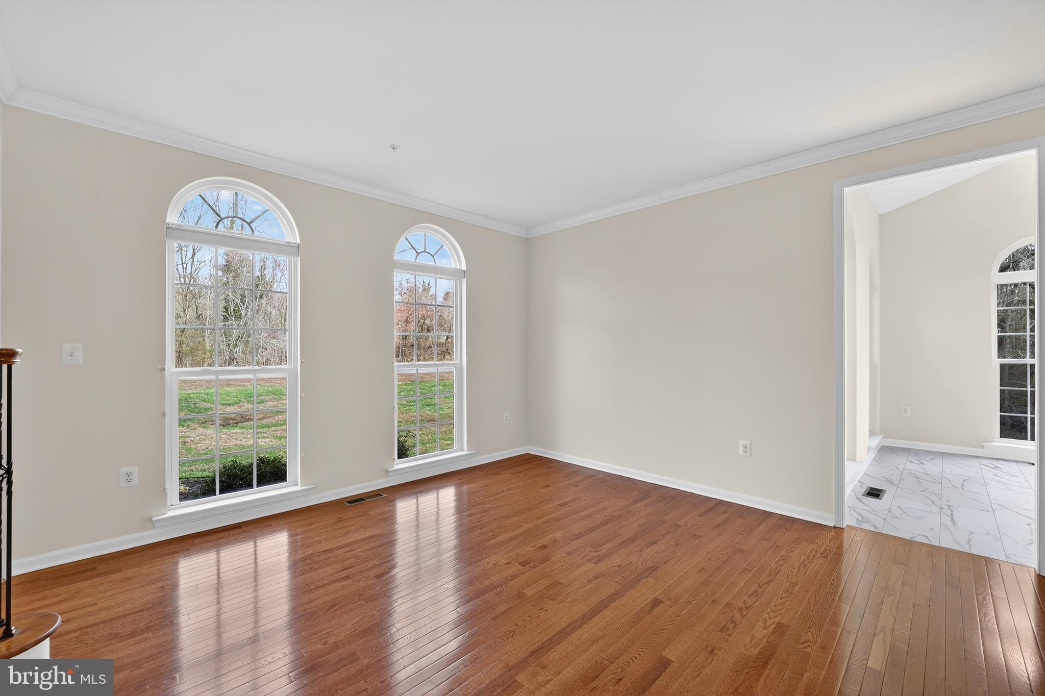 16101 Venice Road Aquasco, MD 20608 - Photo 27 of 60 a view of empty room with wooden floor and fan