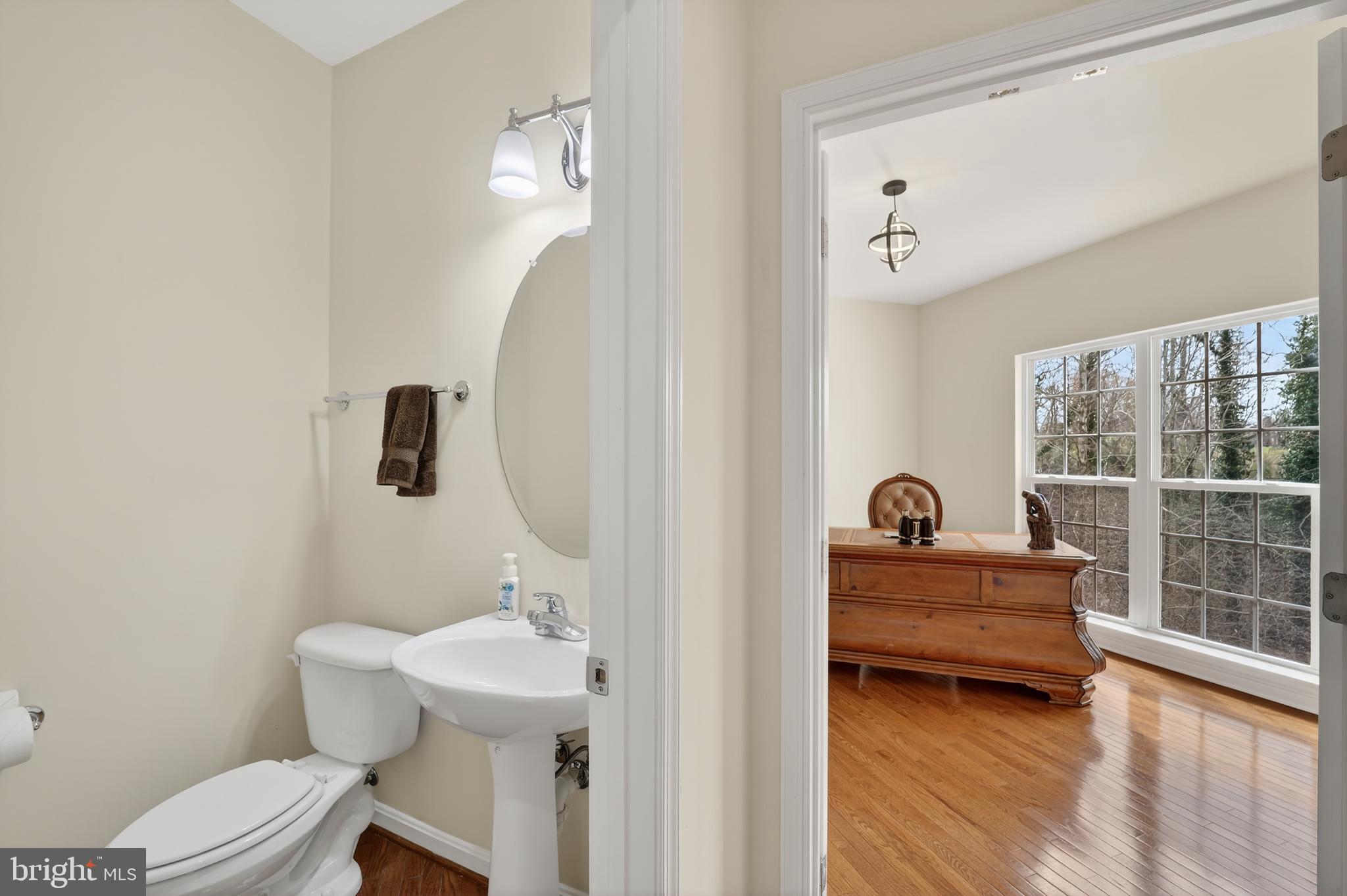 16101 Venice Road Aquasco, MD 20608 - Photo 30 of 60 a bathroom with a sink a toilet and a mirror