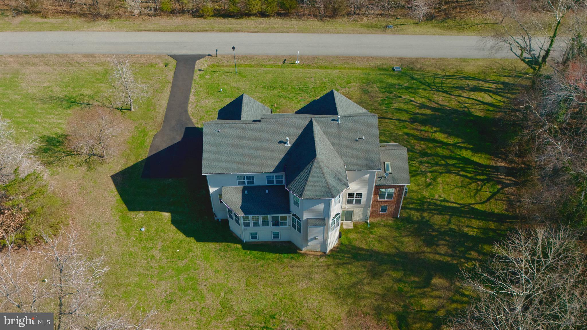 16101 Venice Road Aquasco, MD 20608 - Photo 3 of 60 a view of a house with a yard