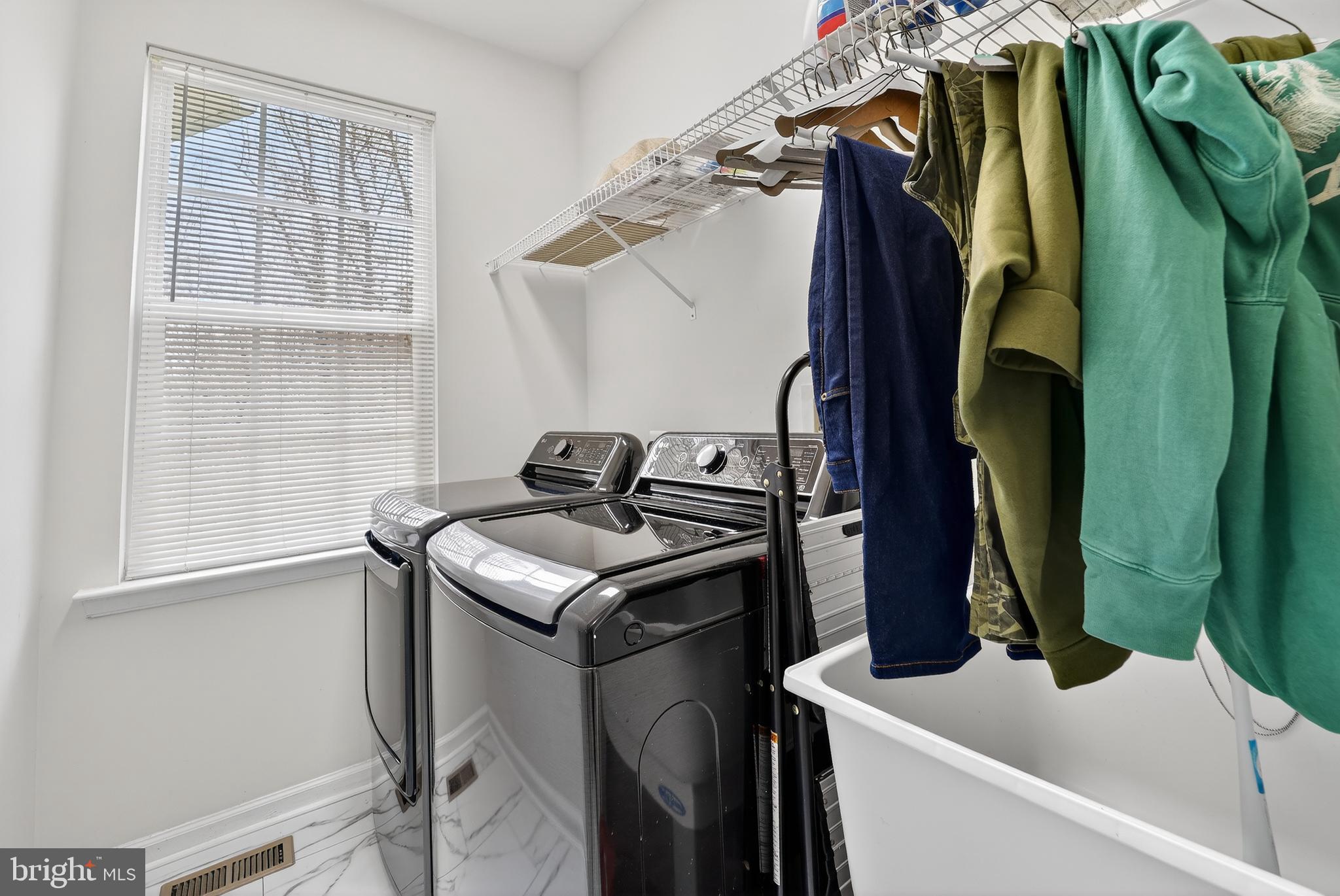 16101 Venice Road Aquasco, MD 20608 - Photo 32 of 60 a view of walk in closet with clothes and shoes