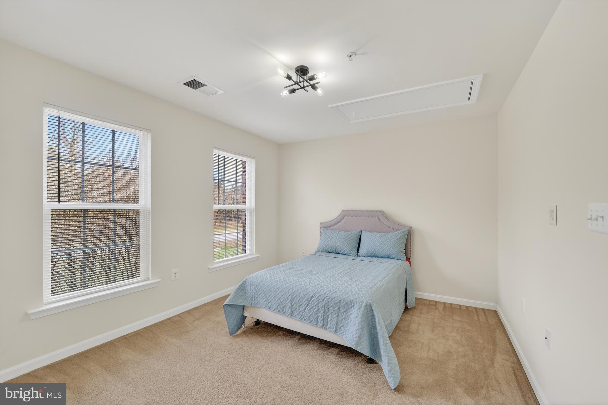 16101 Venice Road Aquasco, MD 20608 - Photo 48 of 60 a bedroom with a bed and a window