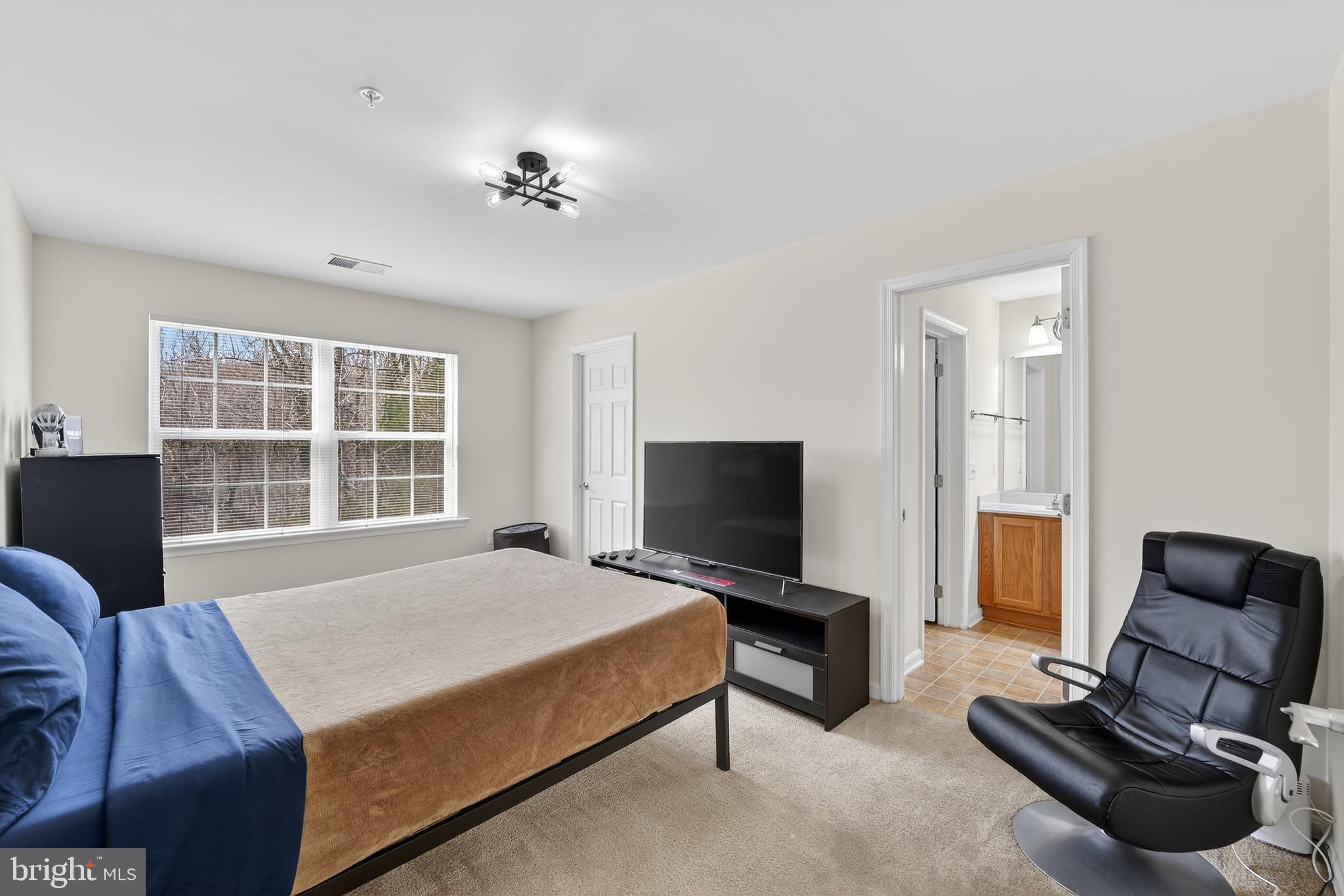 16101 Venice Road Aquasco, MD 20608 - Photo 51 of 60 a bedroom with a bed and a television