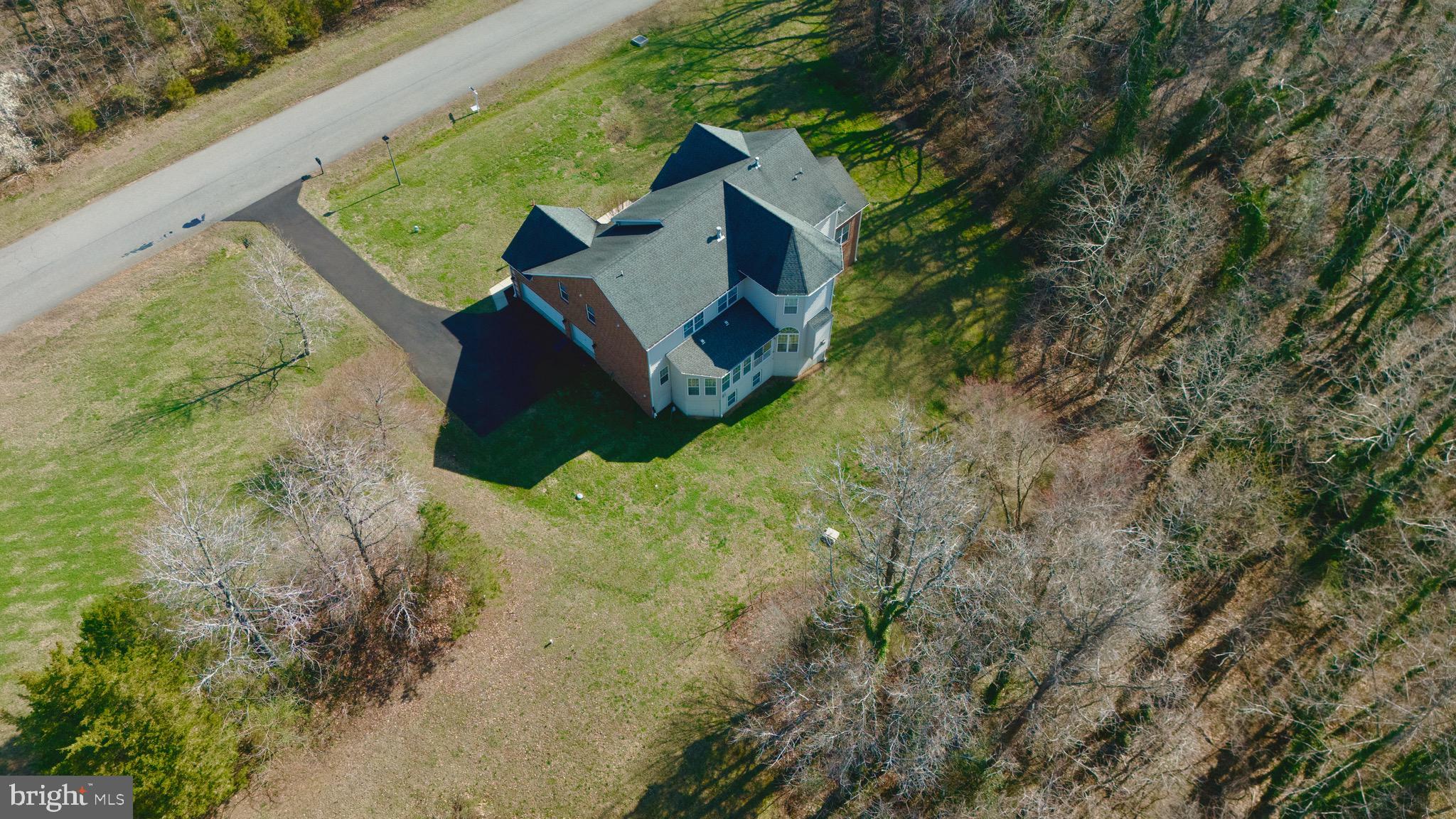 16101 Venice Road Aquasco, MD 20608 - Photo 56 of 60 a view of a house with a yard