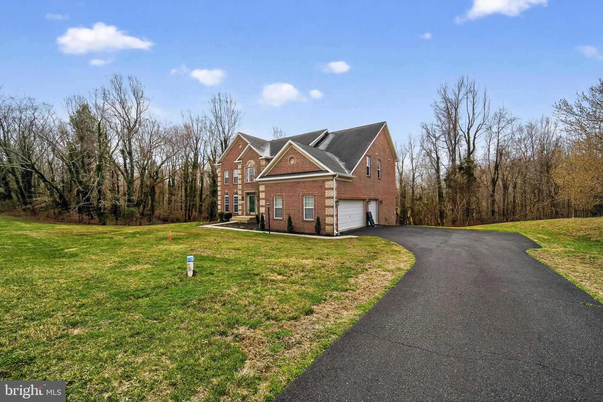 16101 Venice Road Aquasco, MD 20608 - Photo 7 of 60 a view of a house with a yard and basketball court