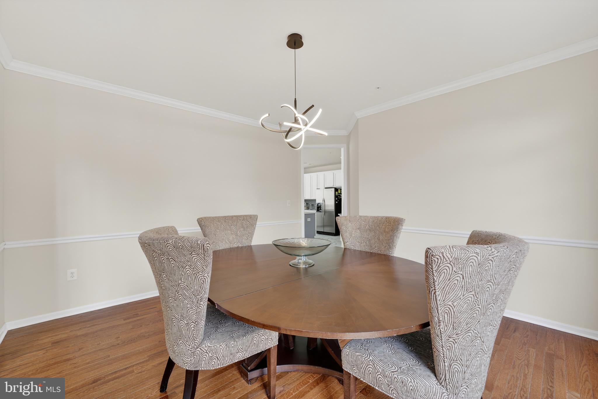 16101 Venice Road Aquasco, MD 20608 - Photo 9 of 60 a view of a dining room with furniture and wooden floor