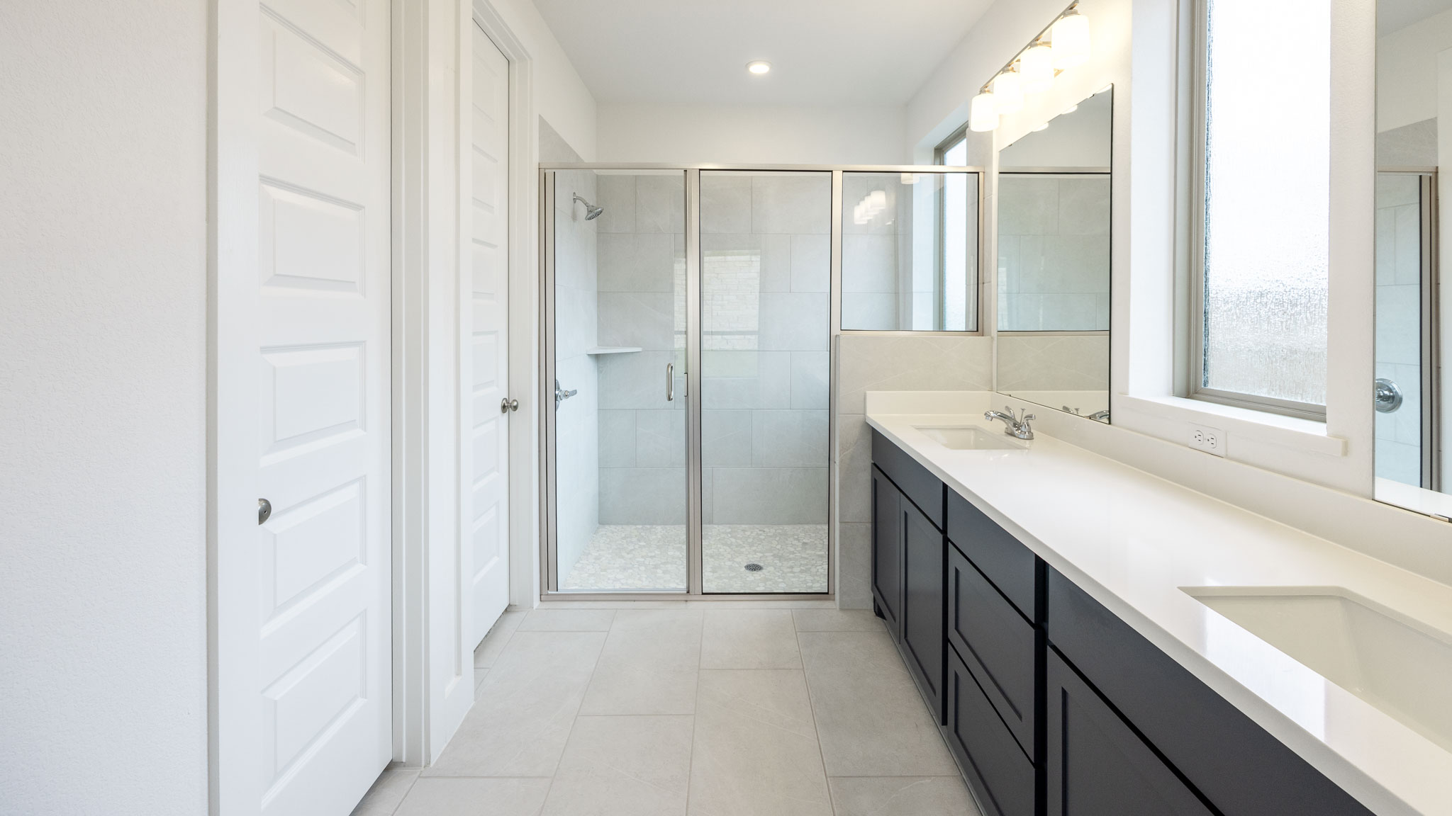 7002 Woodford Way Austin, TX 78744 - Photo 8 of 22 a bathroom with a double vanity sink mirror and double