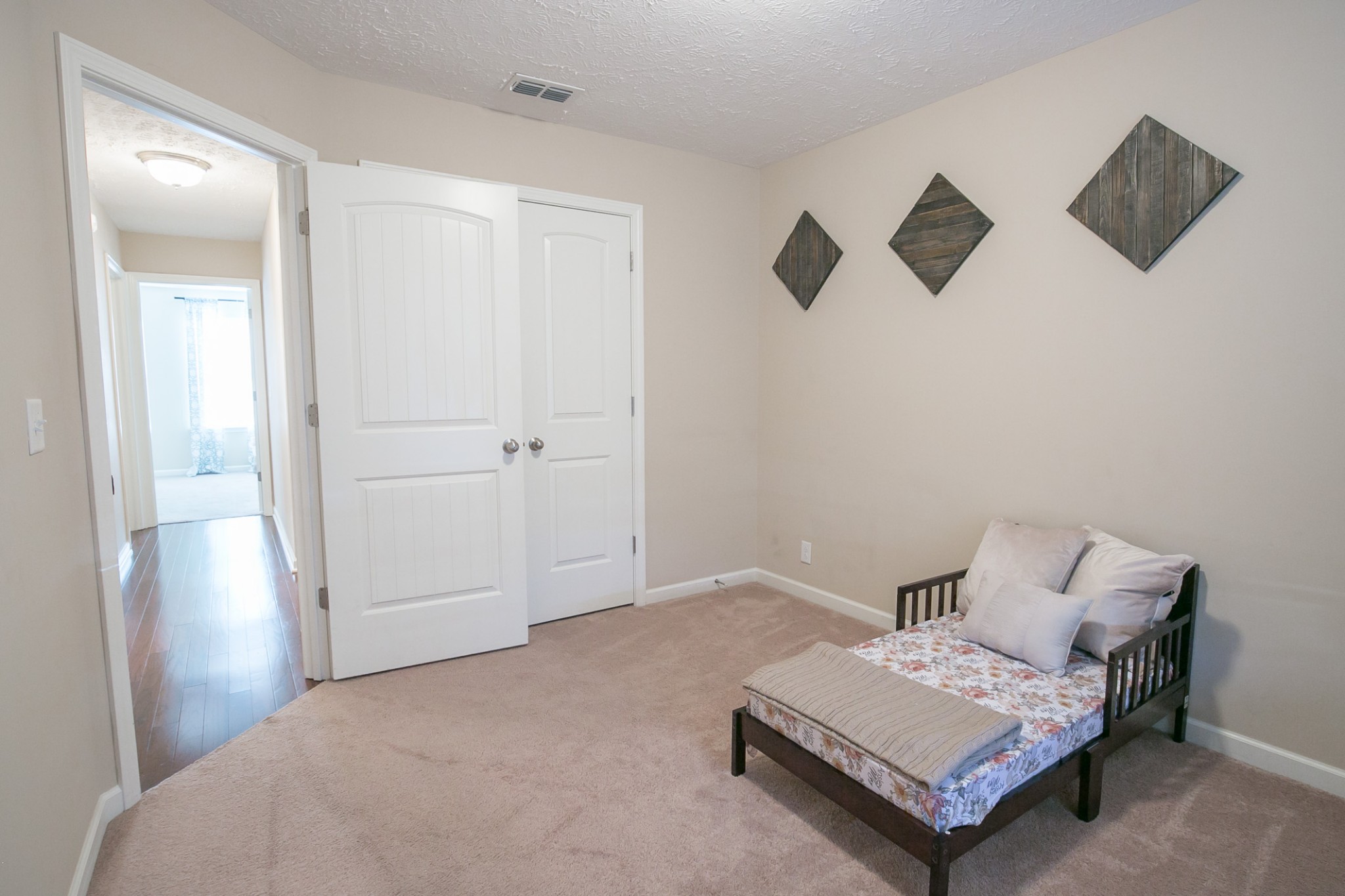 125 Copper Leaf Road Murfreesboro, TN 37128 - Photo 32 of 50 a spacious bedroom with a bed and a tv