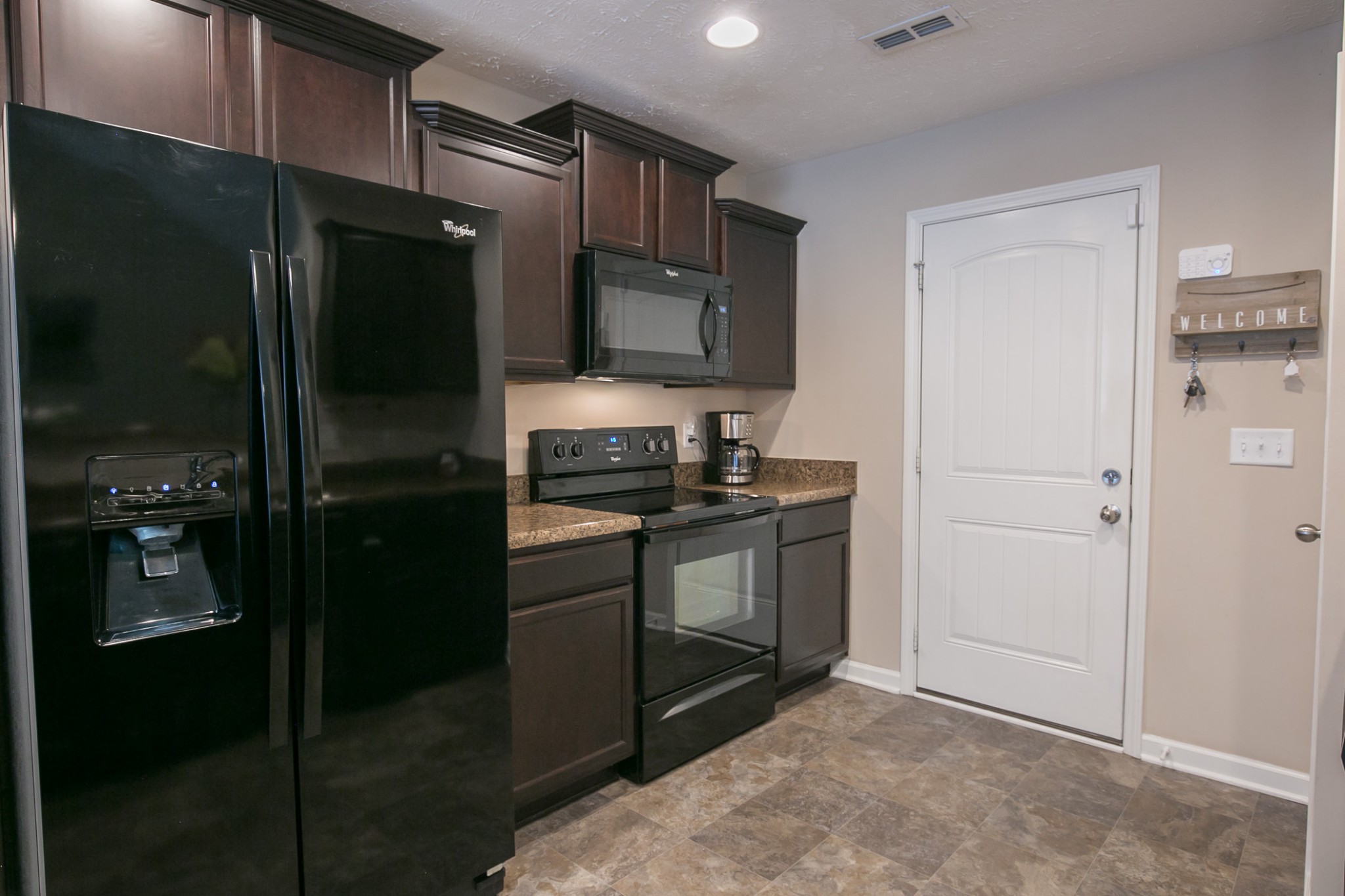 125 Copper Leaf Road Murfreesboro, TN 37128 - Photo 46 of 50 a kitchen with a refrigerator and a sink