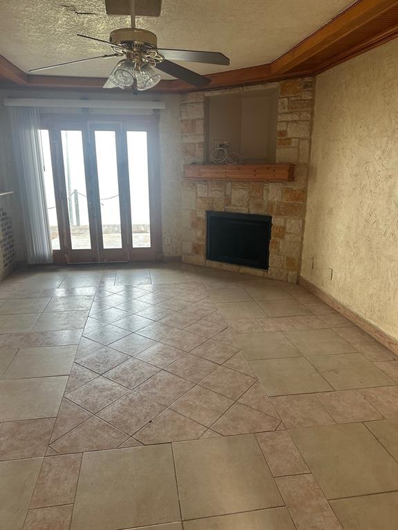 4610 Chaha Road, Unit 101 Garland, TX 75043 - Photo 2 of 18 a view of empty room with a fireplace and chandelier