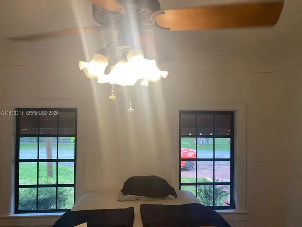 a balcony with table and chairs