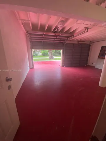 a view of a hallway with two windows