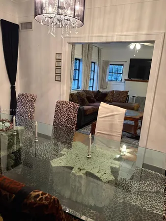 a bedroom with a large bed and a large window