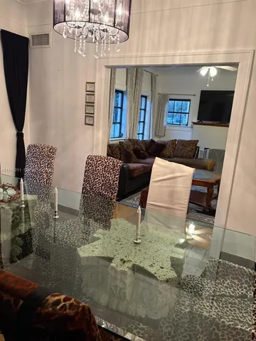 a bedroom with a large bed and a large window