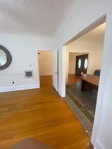 a view of a living room and bathroom