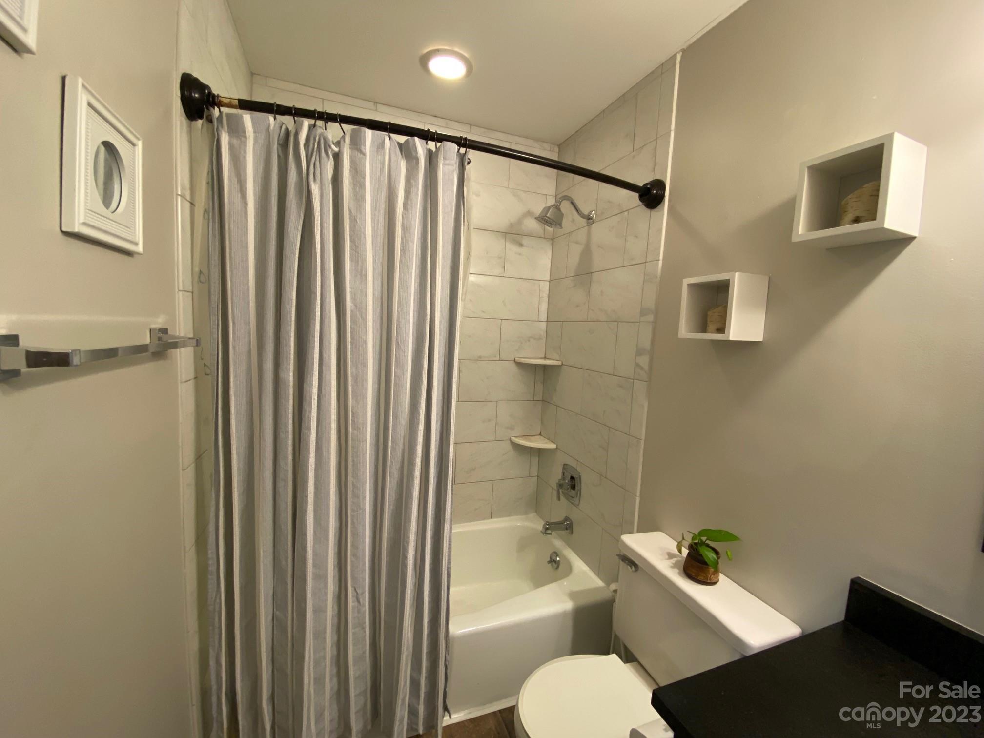 5901 Potter Road Matthews, NC 28104 - Photo 21 of 38 a bathroom with a sink toilet and shower
