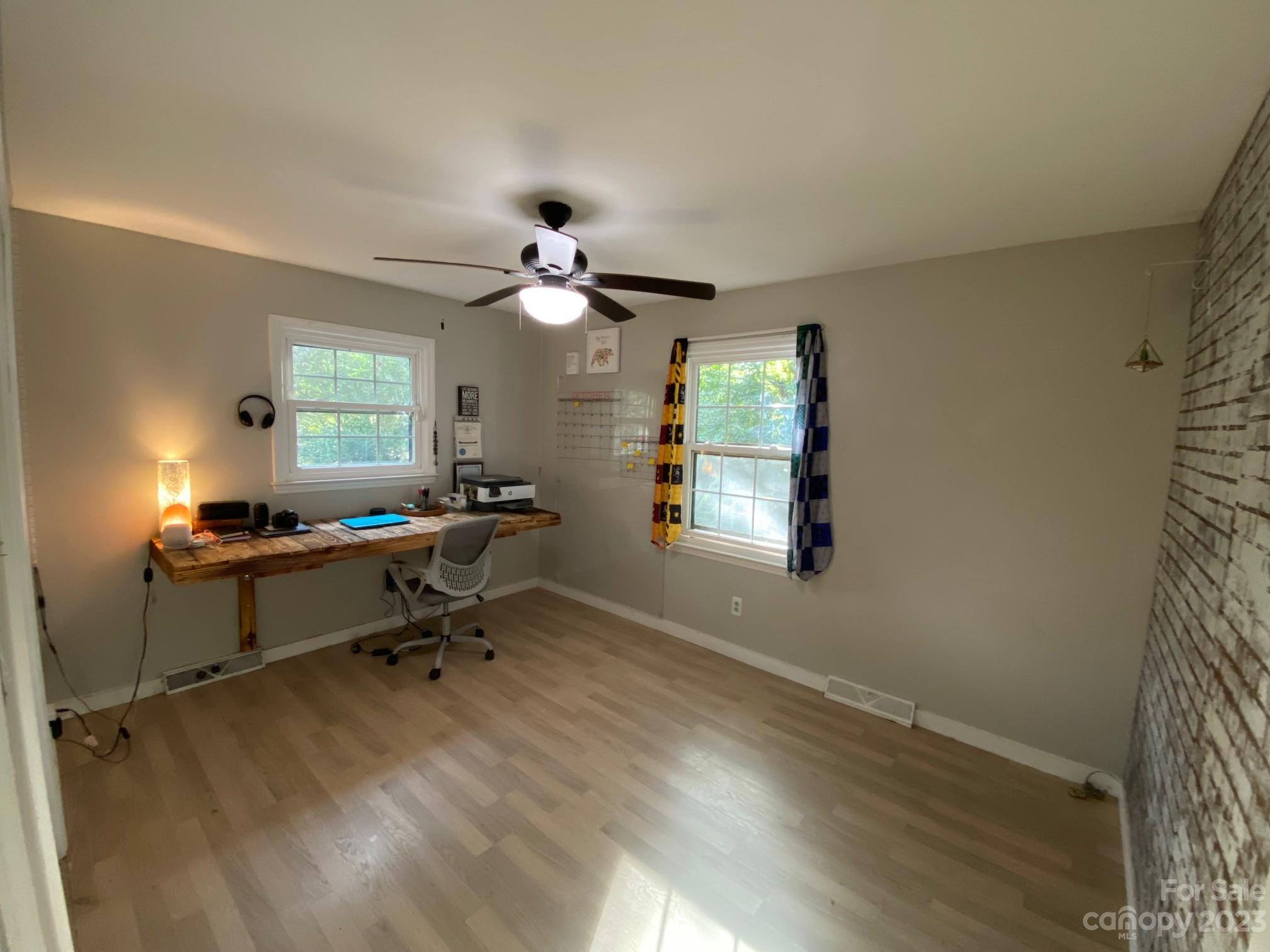 5901 Potter Road Matthews, NC 28104 - Photo 28 of 38 a view of a workspace with furniture and a window