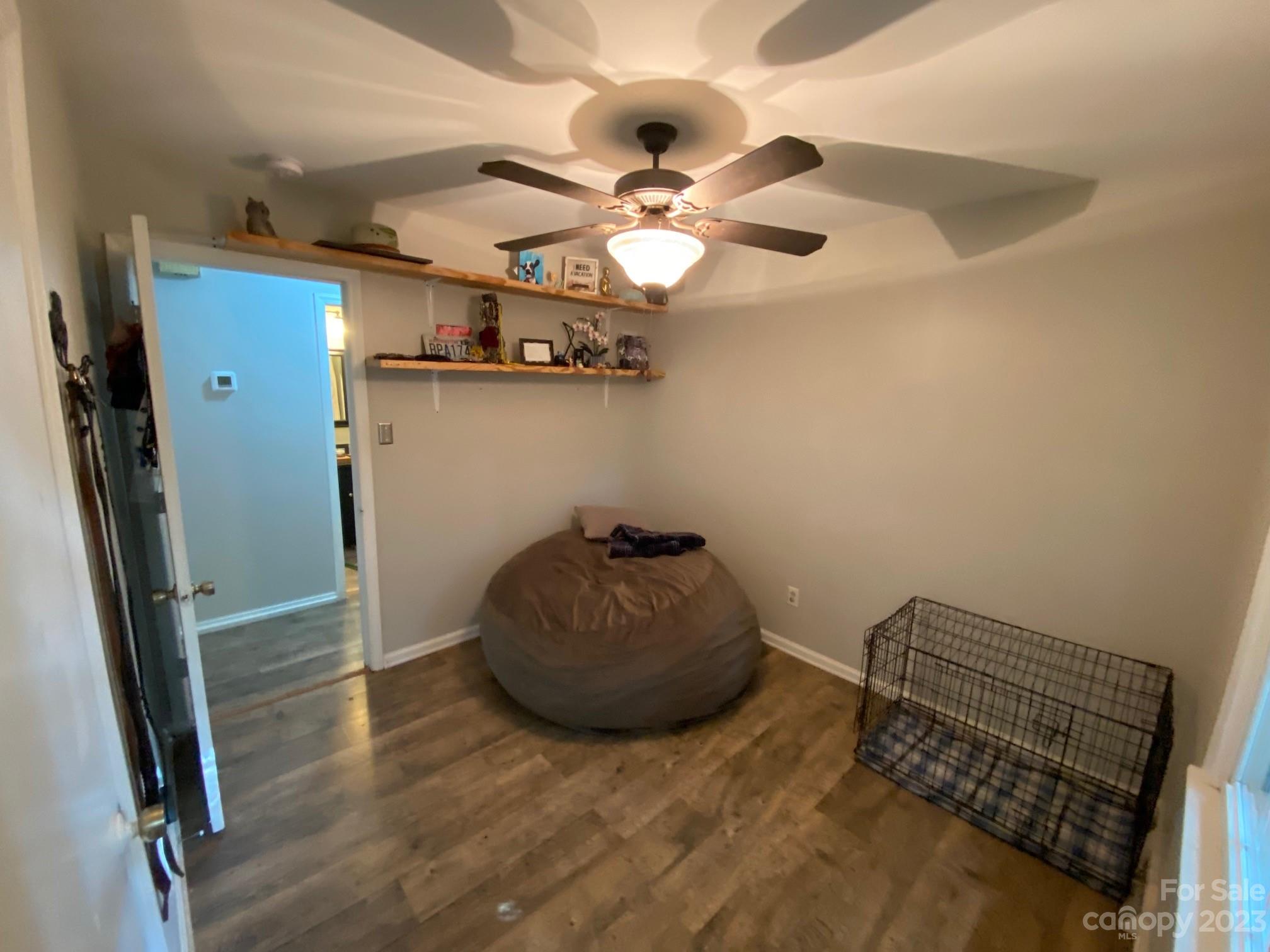 5901 Potter Road Matthews, NC 28104 - Photo 34 of 38 a living room with couch and a ceiling fan