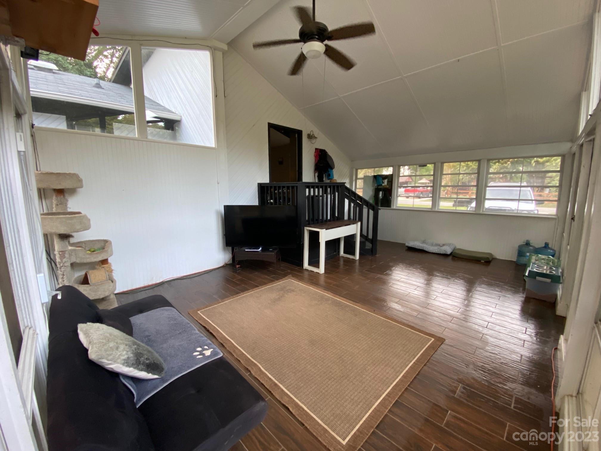5901 Potter Road Matthews, NC 28104 - Photo 36 of 38 a living room with furniture and a wooden floor