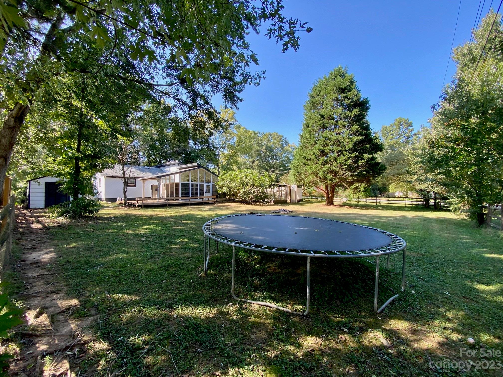 5901 Potter Road Matthews, NC 28104 - Photo 6 of 38 a backyard of a house with table and chairs