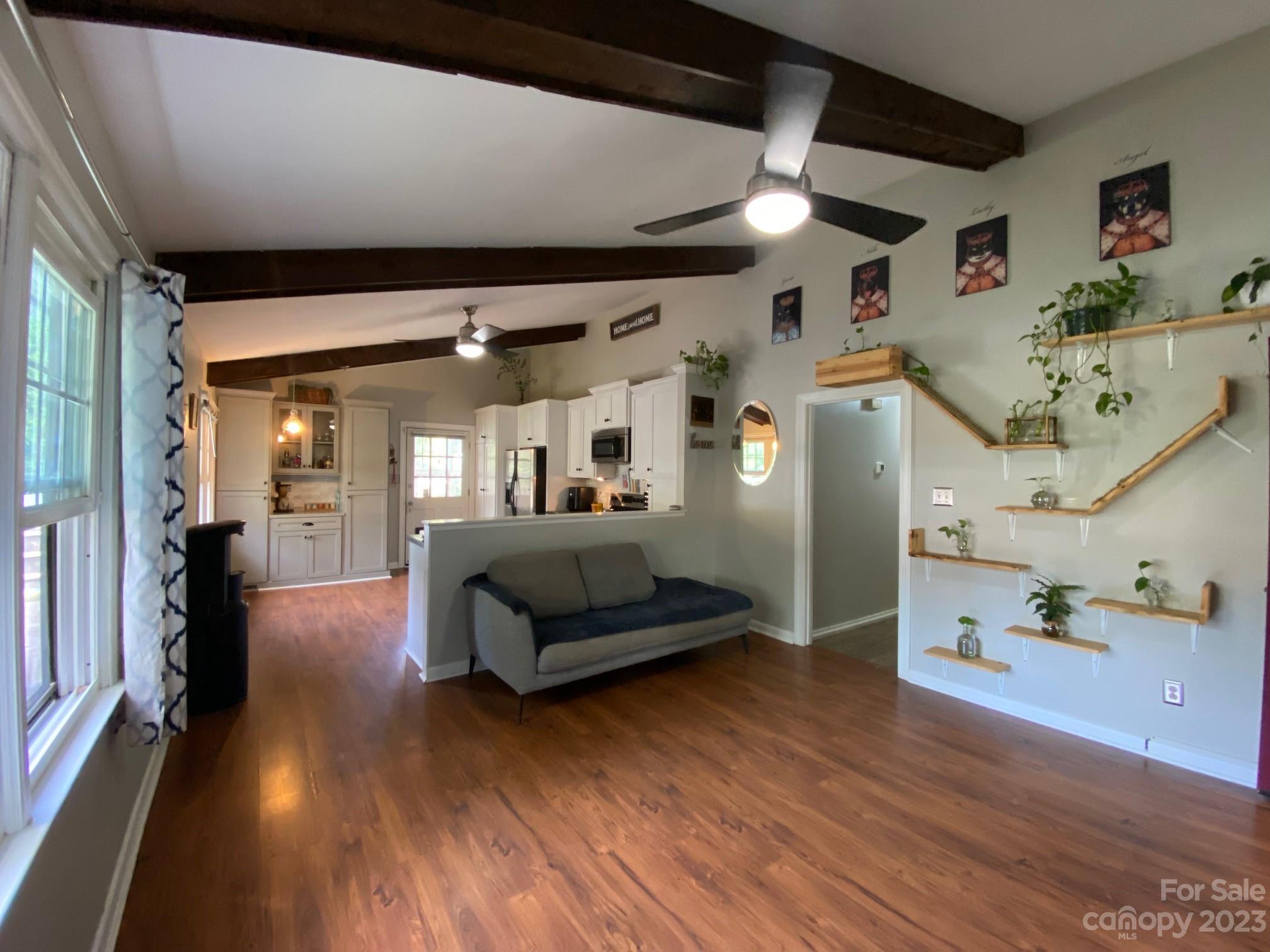 5901 Potter Road Matthews, NC 28104 - Photo 8 of 38 a living room with furniture and a wooden floor