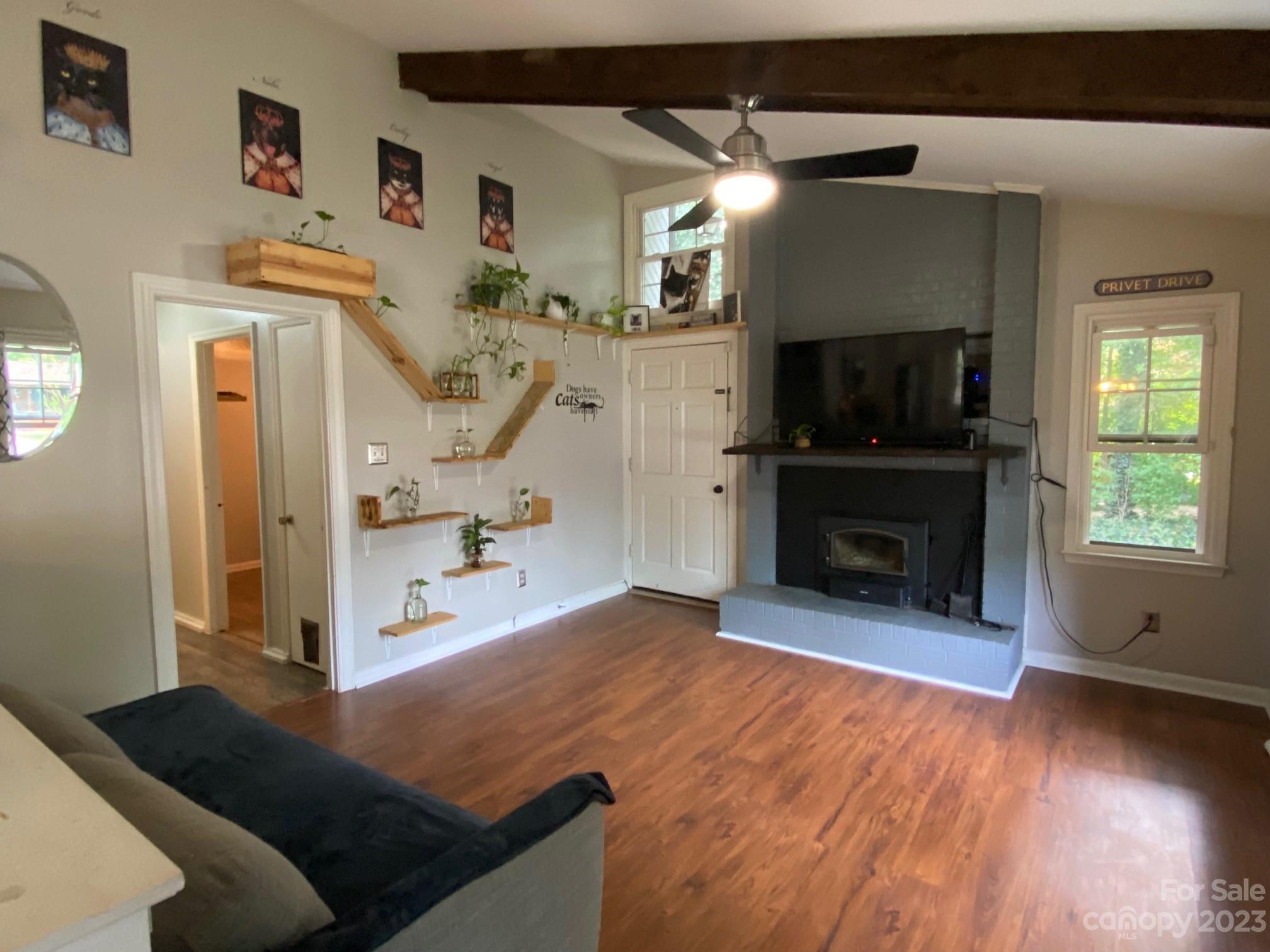 5901 Potter Road Matthews, NC 28104 - Photo 10 of 38 a living room with furniture and a flat screen tv
