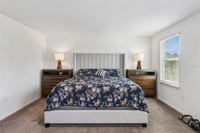 a living room with furniture kitchen view and a couch