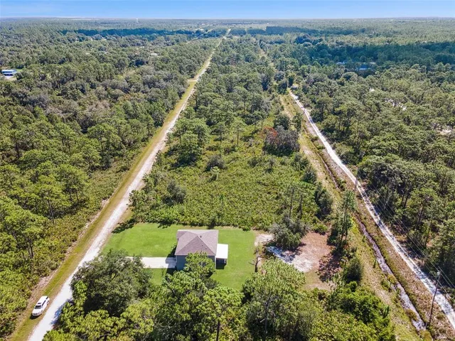 a view of a field with an ocean