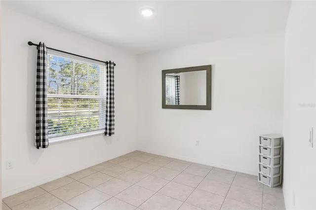 a bathroom with a sink mirror vanity and toilet
