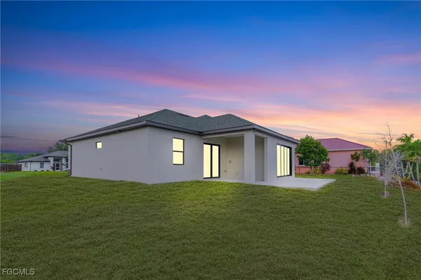 a front view of a house with a yard