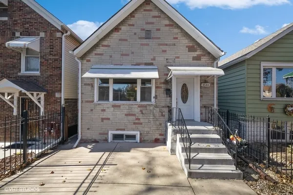 a front view of a house with stairs