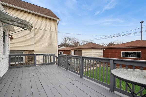 a view of a wooden deck with a yard