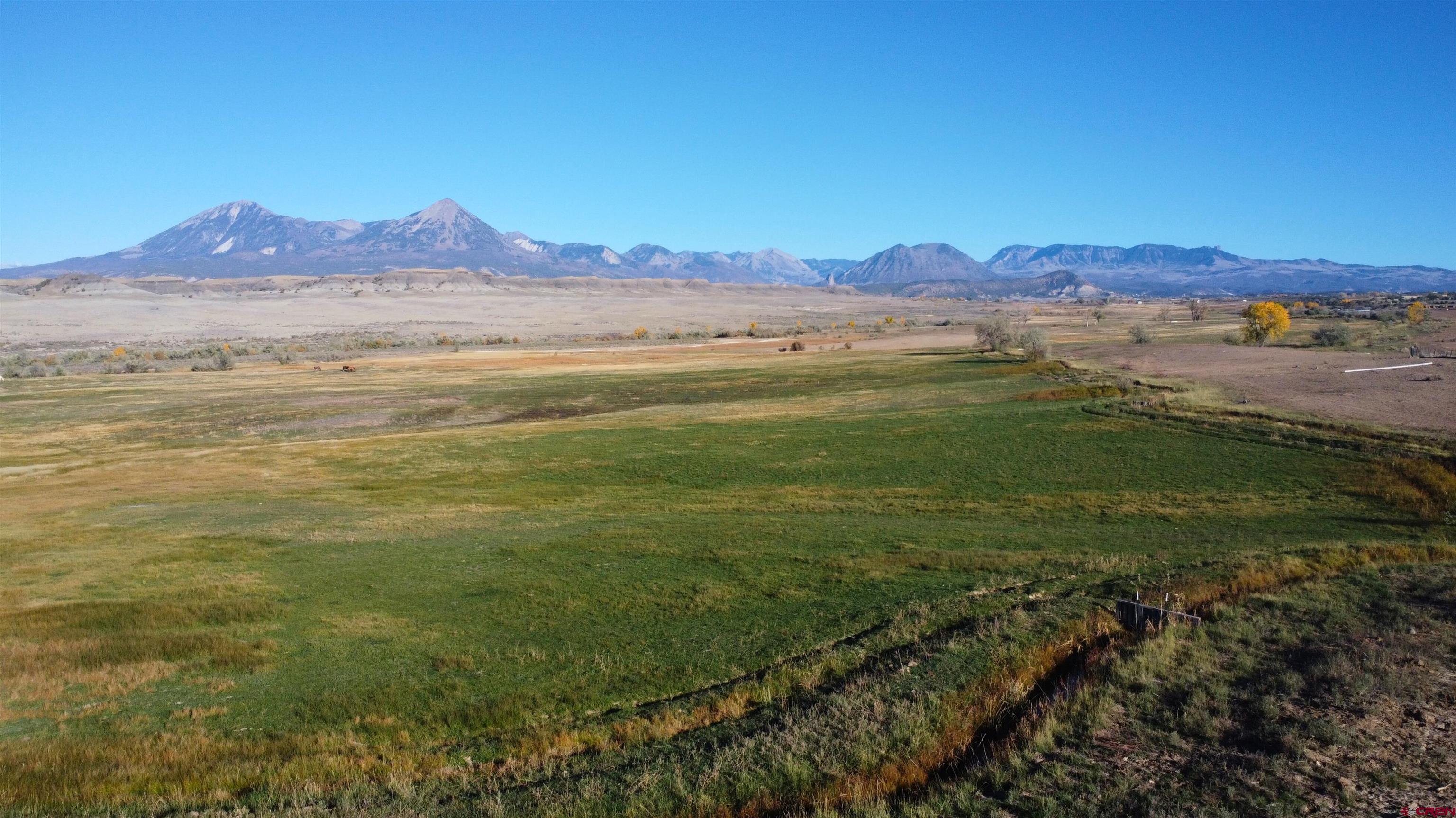 a view of an ocean and a mountain