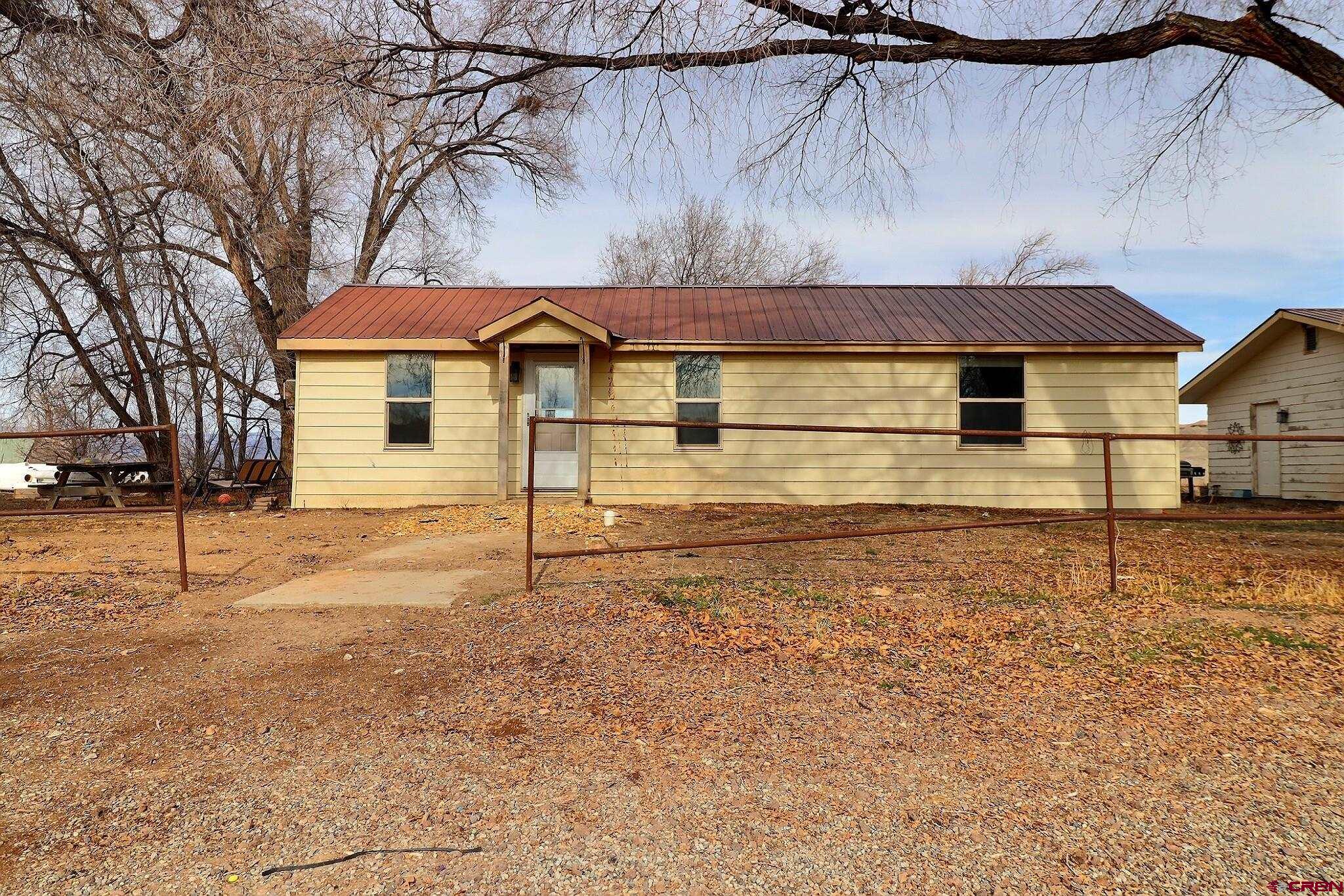 34607 F50 Road Hotchkiss, CO 81419 - Photo 17 of 38 a house with trees in front of it