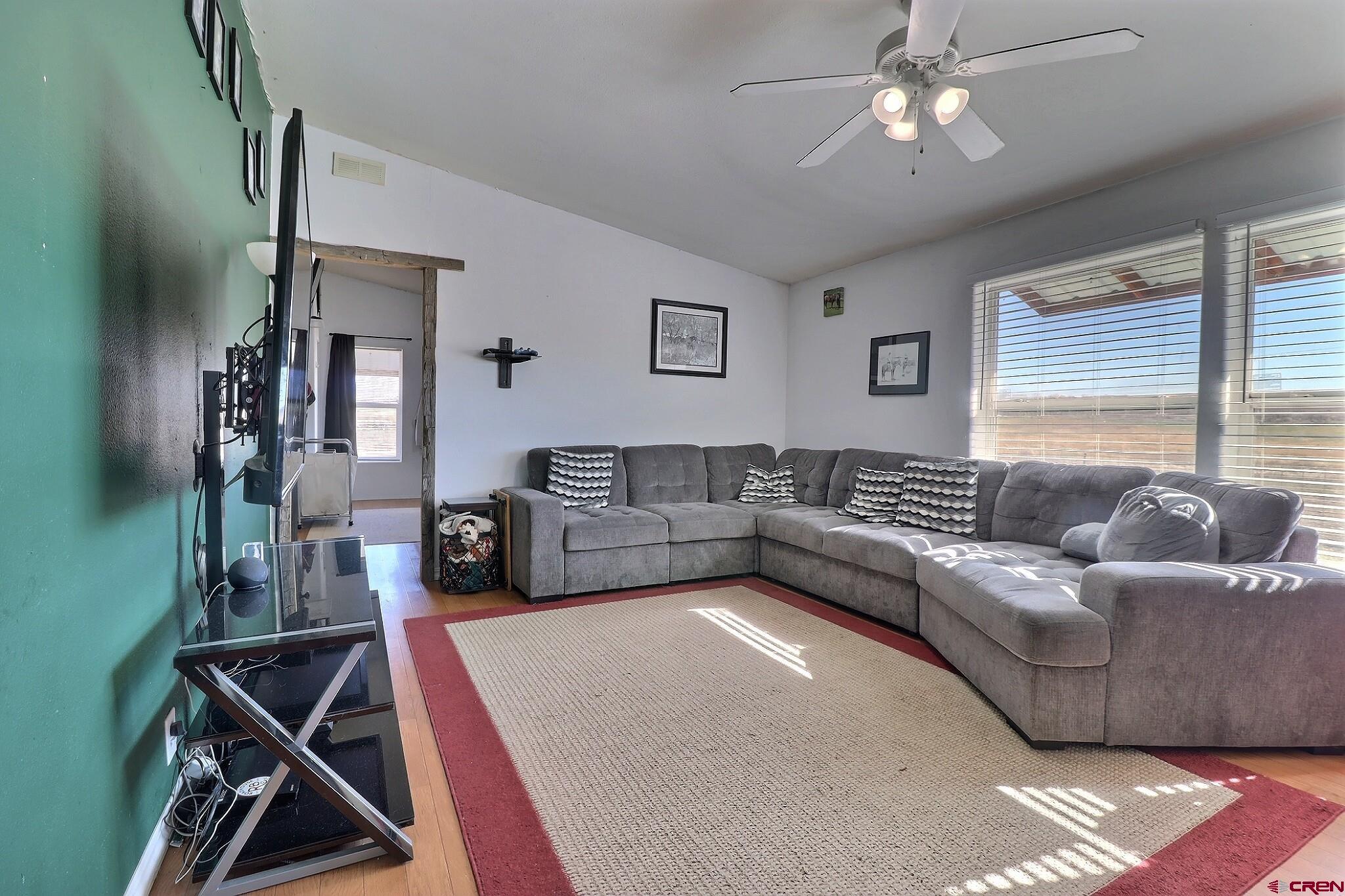 34607 F50 Road Hotchkiss, CO 81419 - Photo 25 of 35 a living room with furniture and a flat screen tv