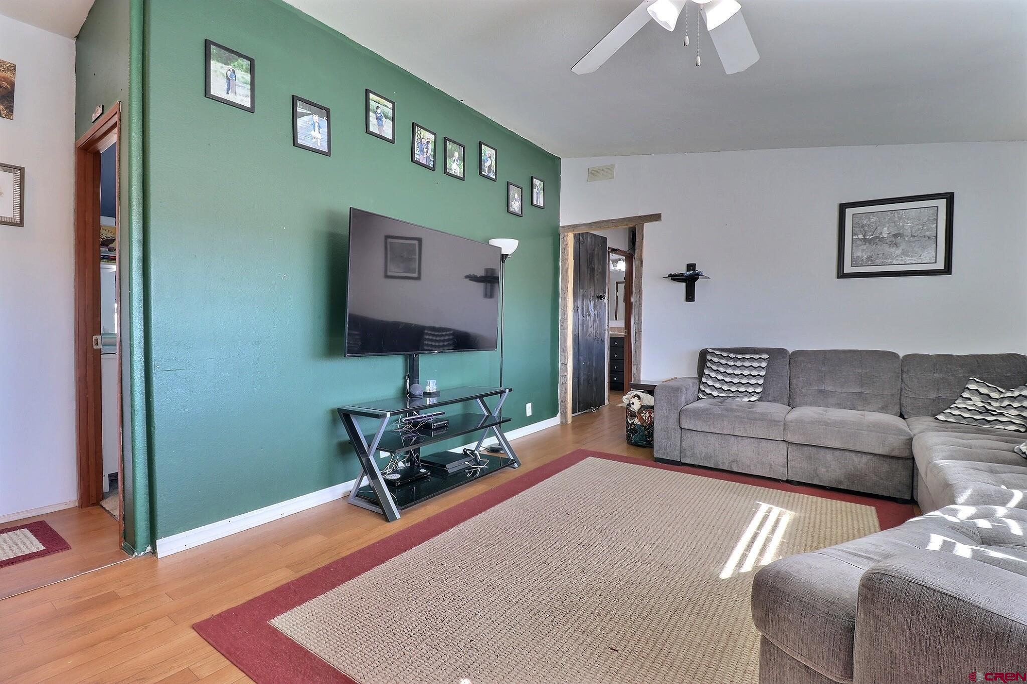 34607 F50 Road Hotchkiss, CO 81419 - Photo 26 of 35 a living room with furniture and a flat screen tv
