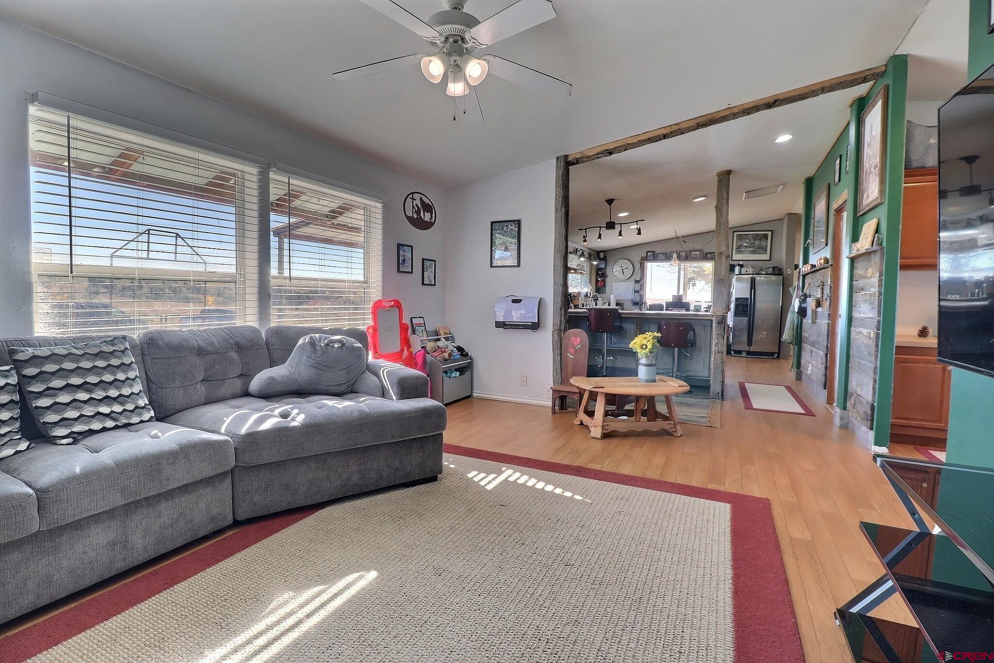 34607 F50 Road Hotchkiss, CO 81419 - Photo 27 of 35 a living room with furniture and a chandelier