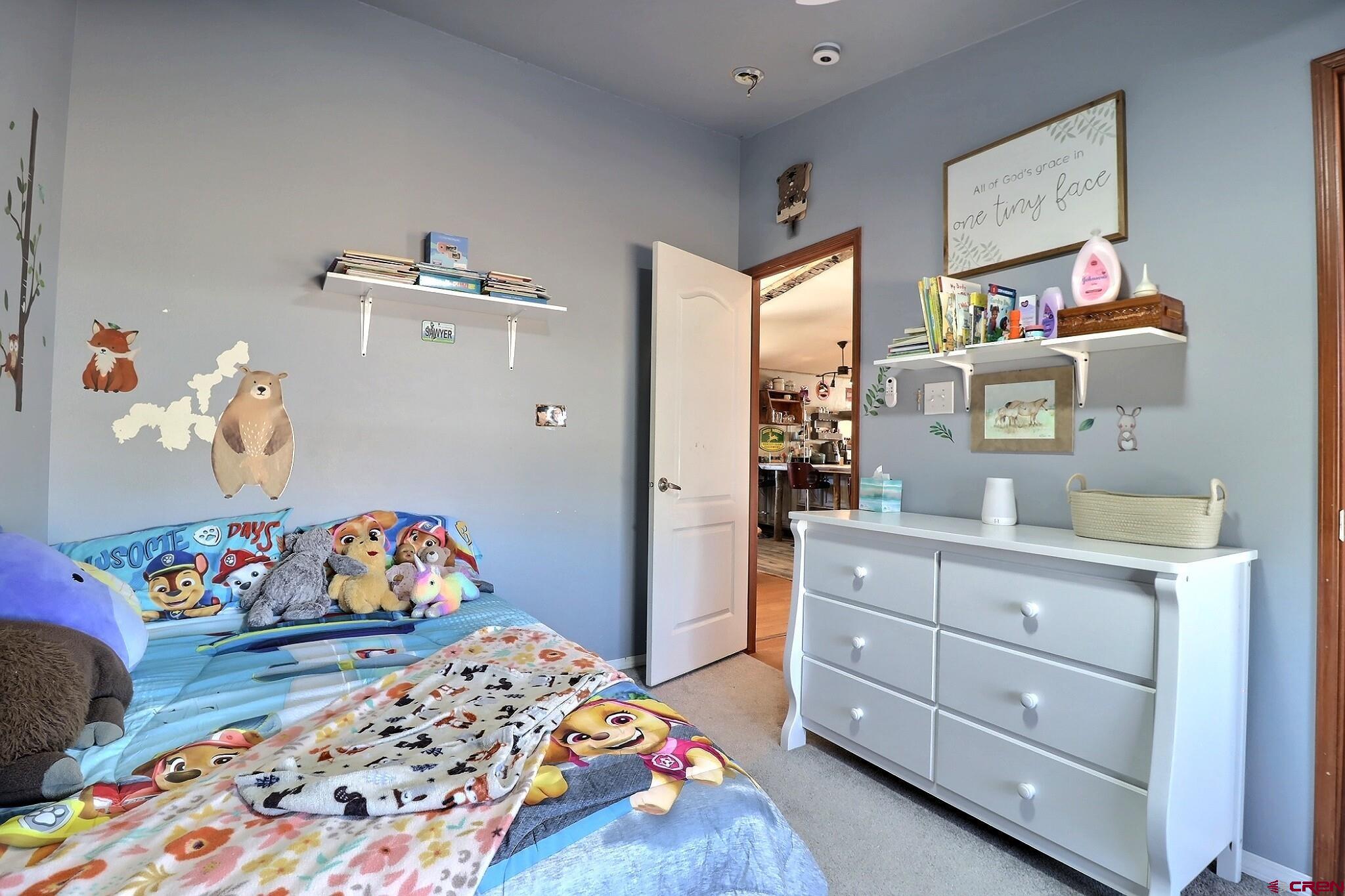 34607 F50 Road Hotchkiss, CO 81419 - Photo 31 of 38 a bedroom with a bed and wooden floor