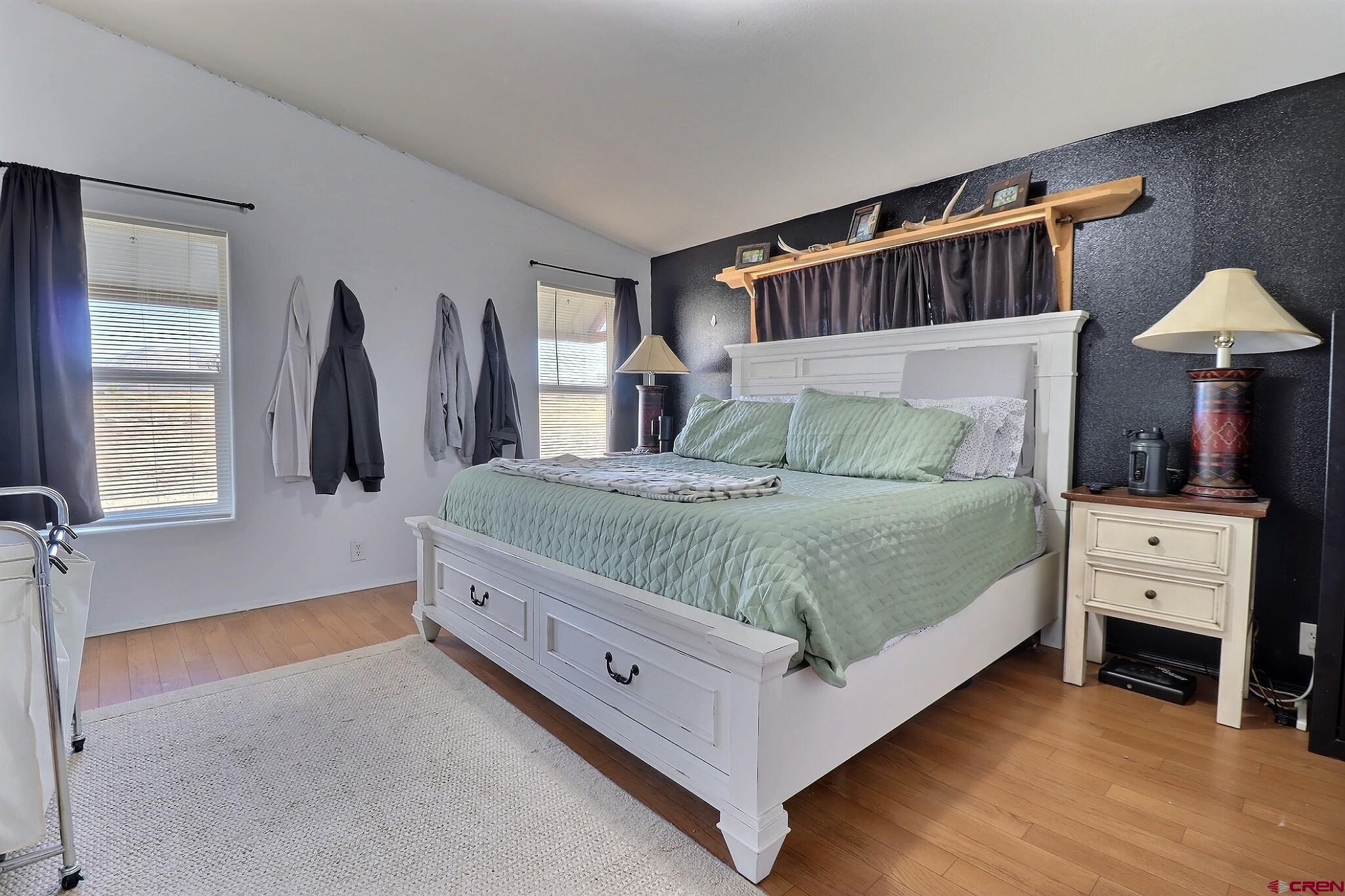 34607 F50 Road Hotchkiss, CO 81419 - Photo 34 of 38 a bedroom with a large bed and a tv on table