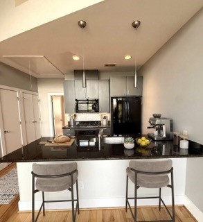 1045 Bonner Street Houston, TX 77007 - Photo 6 of 14 a kitchen with refrigerator and chairs
