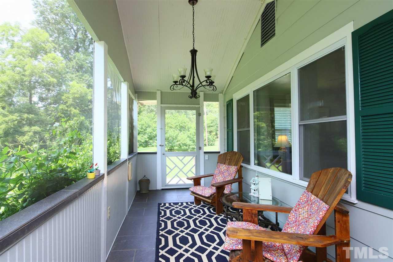 3002 University Station Road Durham, NC 27705 - Photo 11 of 30 Three doors off of the porch lead to front and back of the house