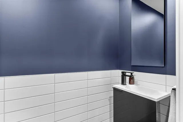 a bathroom with a sink and mirror