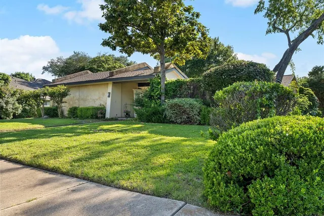 a view of a backyard with a garden