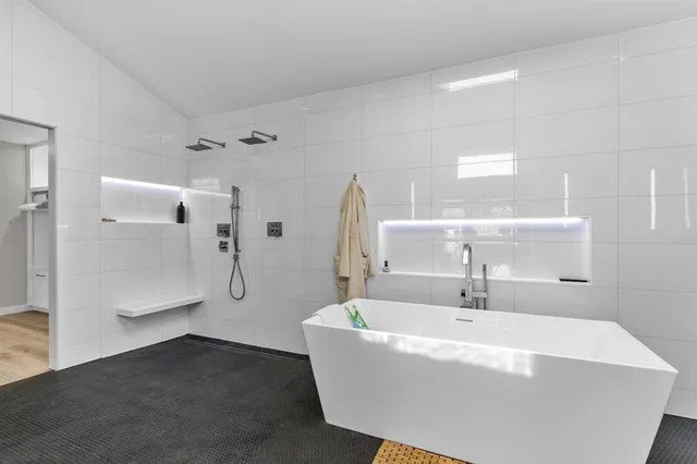 a white bath tub sitting in a bathroom