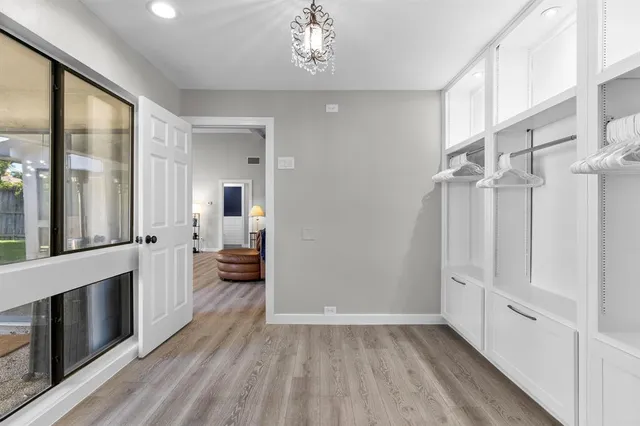 a view of a hallway view with wooden floor and staircase