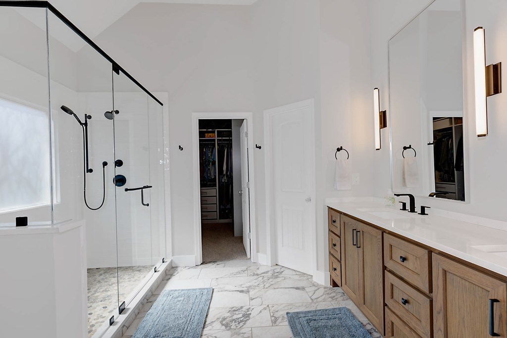 6712 Bridge Way Columbus, GA 31904 - Photo 21 of 36 a bathroom with a shower sink and mirror
