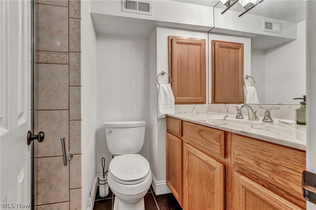 2914 Chadbourne Road Cleveland, OH 44120 - Photo 23 of 48 Bathroom featuring vanity, toilet, and tile floors