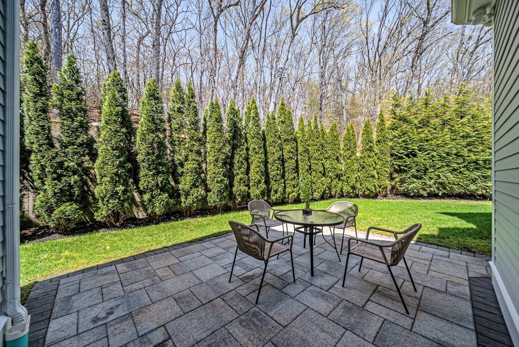 17 Sunrise Terrace Needham, MA 02492 - Photo 38 of 42 a view of a chairs and table in the garden
