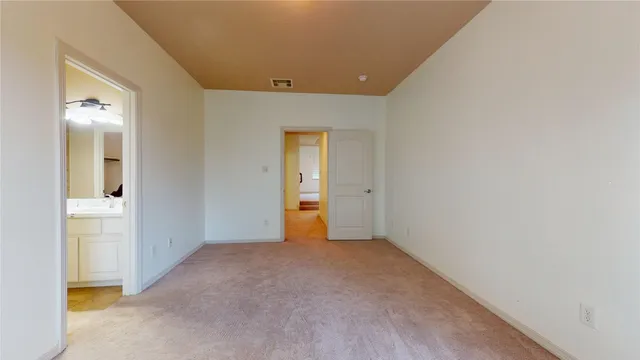 a living room with lots of furniture and a large window