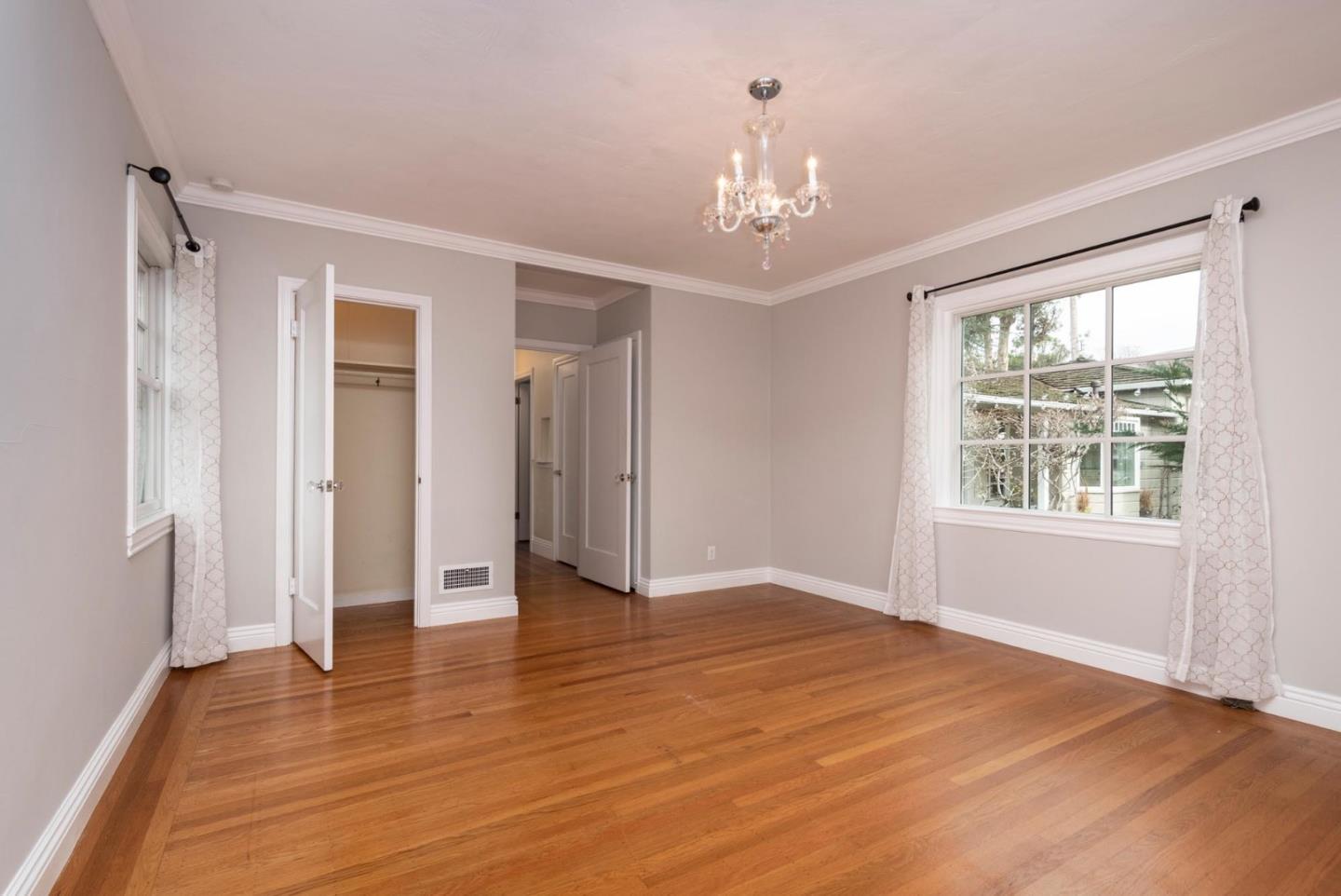 1508 Arc Way Burlingame, CA 94010 - Photo 15 of 18 a view of an empty room with wooden floor and a window